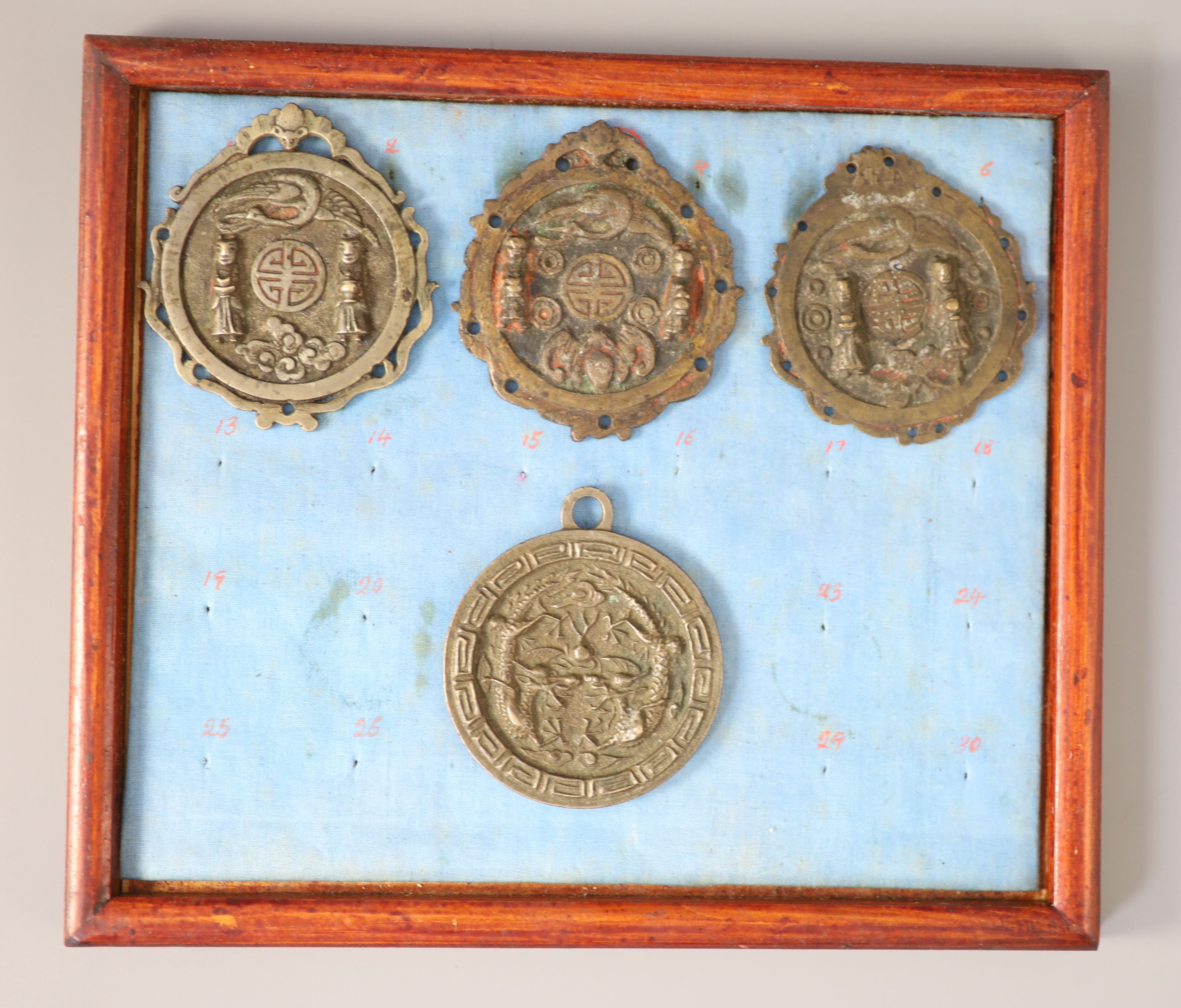 A group of 99 Korean bronze and metal amulets or charms, 19th/20th century